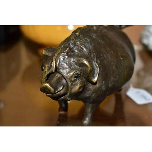 447 - A 19TH CENTURY STYLE NOVELTY BRONZE TABLE BELL IN THE FRORM OF A PIG, fitted with a clockwork moveme... 