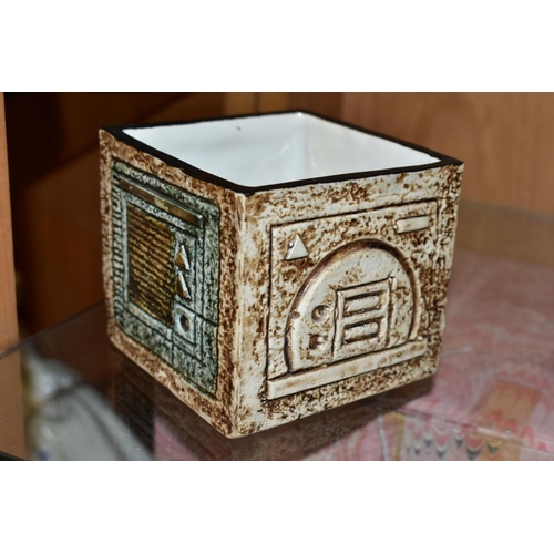 455 - A TROIKA POTTERY CUBE VASE, the four sides with textured geometric designs in buff, brown and green ... 