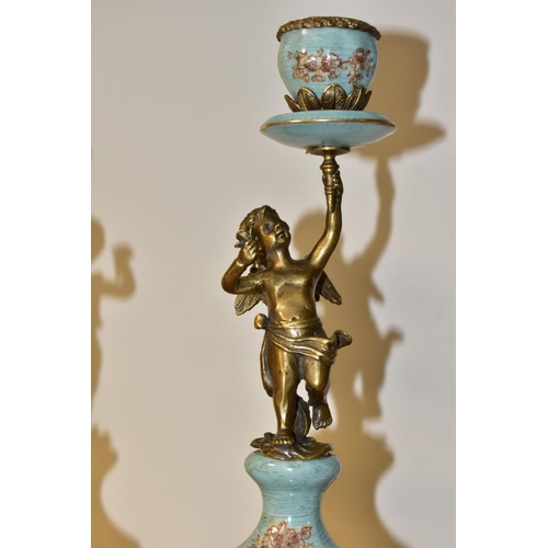 460 - A PAIR OF REPRODUCTION TURQUOISE PORCELAIN AND BRASS FIGURAL CANDLEHOLDERS OF LATE 19TH CENTURY STYL... 