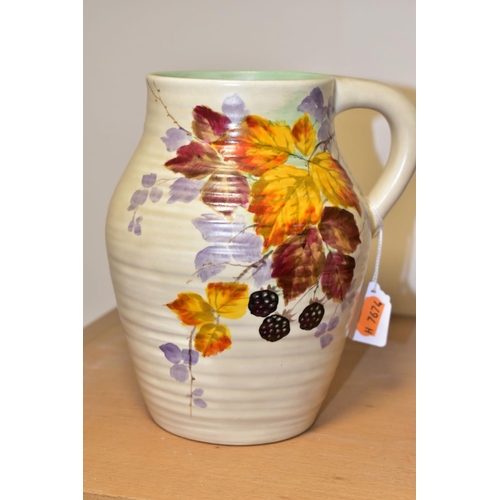 462 - A CLARICE CLIFF WILKINSON LTD HANDLED MOULDED AND RIBBED VASE PAINTED WITH BLACKBERRIES AND BRAMBLES... 