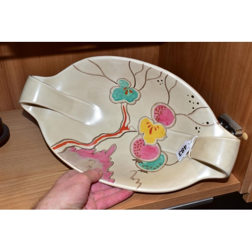 483 - A CLARICE CLIFF WILKINSON LTD POTTERY TWIN HANDLED OVAL BOWL PAINTED WITH A FRUITING POMEGRANATE TRE... 