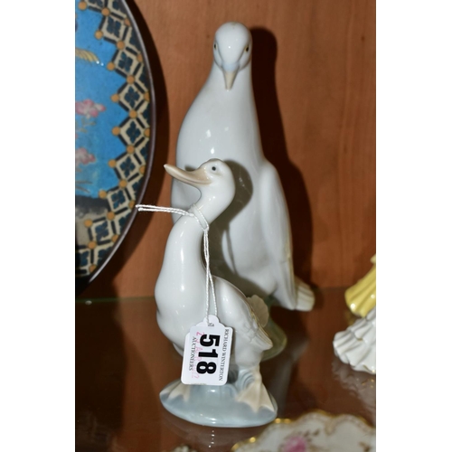 518 - THREE NAO ORNAMENTS, comprising a pigeon, height 21cm, a duck, height 14.5cm and a group of two pupp... 