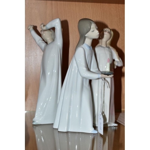 540 - THREE LLADRO FIGURES OF CHILDREN IN NIGHTDRESSES, comprising Nos 4868 'Girl with Candle', 4870 'Boy ... 