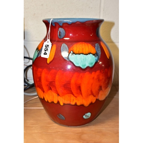 554 - A POOLE POTTERY VOLCANO PATTERN VASE OF BALUSTER FORM, red, orange, blue and green glazes, moulded m... 