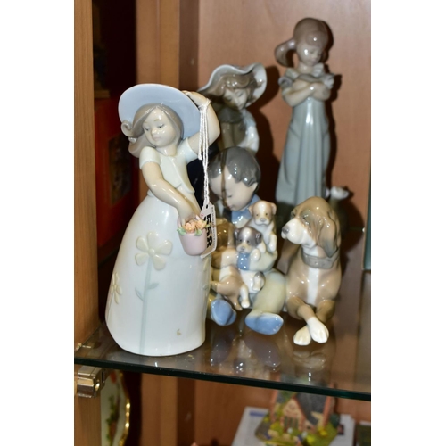 558 - FOUR LLADRO FIGURES OF CHILDREN, comprising Little Daisy, no. 8041, sculpted by Jose Santaeulalia, i... 