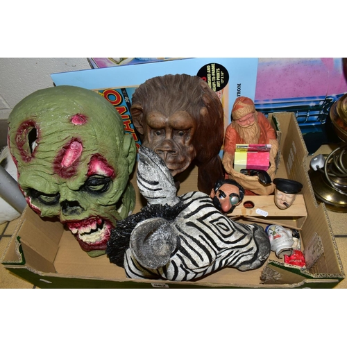 562 - A BOX AND LOOSE RESIN ANIMAL MASKS, ZOMBIE HEAD, BOTTLE STOPPERS, ETC, including a painted plaster W... 