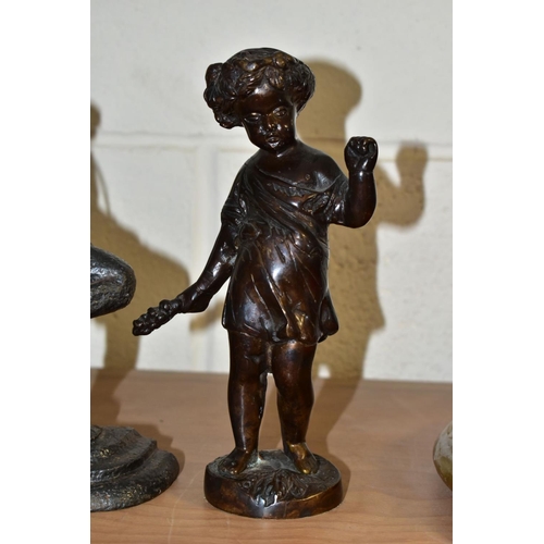 564 - A 20TH CENTURY BRONZE FIGURE OF A PUTTI AND A CAST IRON MR PUNCH DOORSTOP, the bronze cast wearing a... 