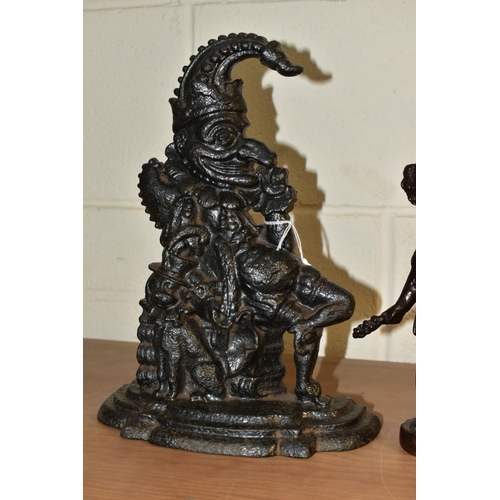 564 - A 20TH CENTURY BRONZE FIGURE OF A PUTTI AND A CAST IRON MR PUNCH DOORSTOP, the bronze cast wearing a... 