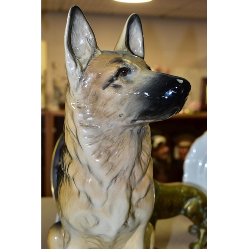 576 - A GROUP OF GERMAN SHEPHERD DOG COLLECTABLES, comprising a large Beswick Seated Alsatian, impressed 2... 