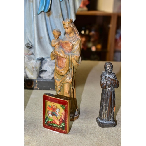 579 - A GROUP OF CHRISTIAN RELIGIOUS STATUES AND ICONS, to include a carved wooden statue of Our Lady of L... 