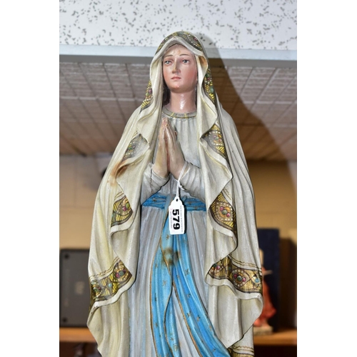 579 - A GROUP OF CHRISTIAN RELIGIOUS STATUES AND ICONS, to include a carved wooden statue of Our Lady of L... 