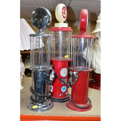 592 - THREE NOVELTY DRINKS DISPENSERS, in the style of vintage American gasoline pumps marked Esso, Drink ... 