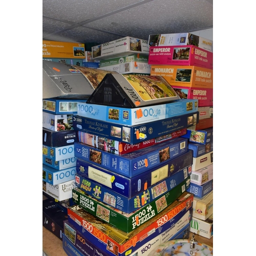 668 - A QUANTITY OF BOXED JIGSAW PUZZLES, approximately sixty to seventy puzzles by manufacturers includin... 