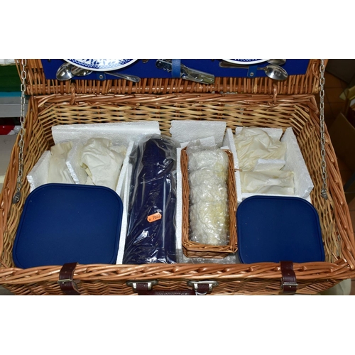 694 - A BROOKES BASKETS WICKER PICNIC HAMPER FOR FOUR PLACE SETTINGS, comprising four Churchill pottery pl... 