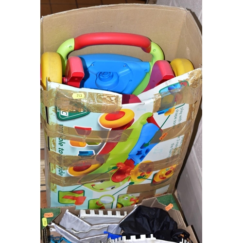 713 - FOUR BOXES AND LOOSE CHILDRENS TOYS, GAMES, BOOKS, ETC including an Early Learning Centre brick trol... 