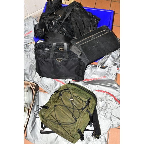 740 - SEVEN USED / MOULD DAMAGED PRADA RUCKSACKS/ COMPUTER BAGS/ HOLDALL, together with eleven fabric draw... 