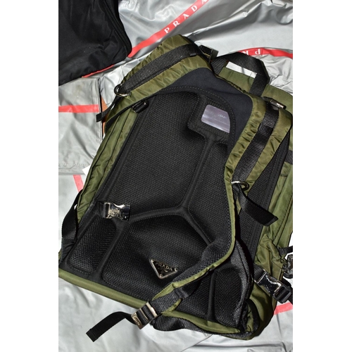 740 - SEVEN USED / MOULD DAMAGED PRADA RUCKSACKS/ COMPUTER BAGS/ HOLDALL, together with eleven fabric draw... 