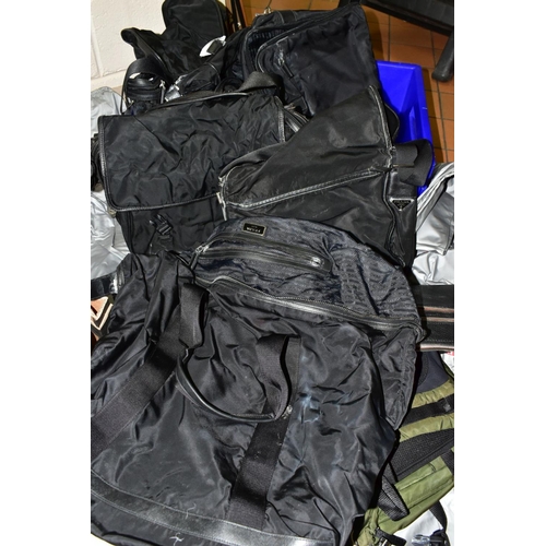 740 - SEVEN USED / MOULD DAMAGED PRADA RUCKSACKS/ COMPUTER BAGS/ HOLDALL, together with eleven fabric draw... 