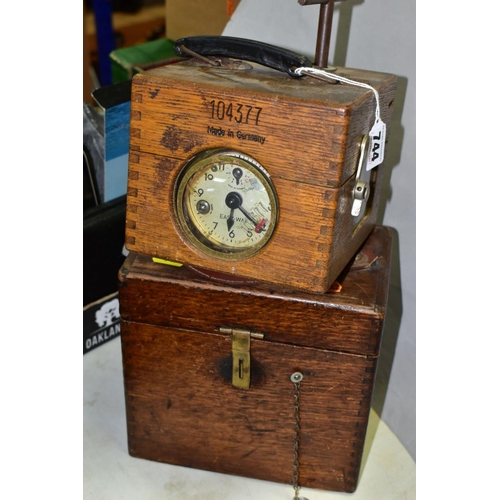 744 - TWO MID 20TH CENTURY OAK CASED PIGEON CLOCKS, comprising a German EASYWAY, number 104377, with key a... 