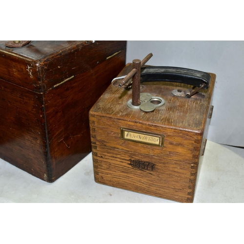 744 - TWO MID 20TH CENTURY OAK CASED PIGEON CLOCKS, comprising a German EASYWAY, number 104377, with key a... 