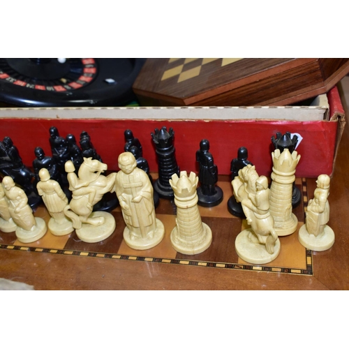 750 - A MODERN CHESS SET COMPRISING A WOODEN BOARD AND PLASTIC CHESS PIECES, together with an octagonal ma... 