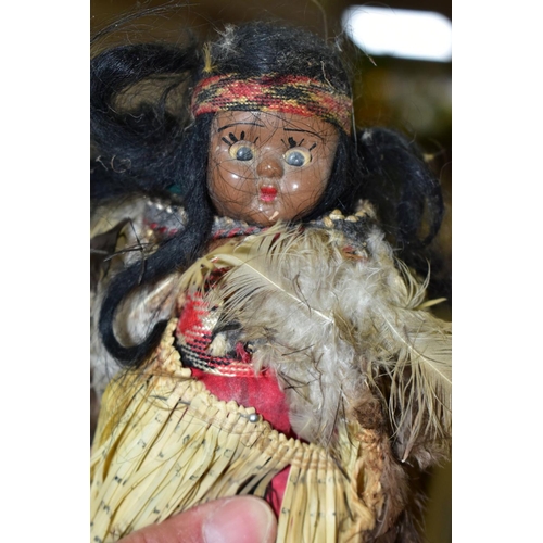 751 - VINTAGE COLLECTORS DOLLS, comprising a M?ori woman with child, tiki pendant around her neck, painted... 