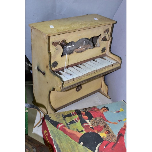 756 - A VINTAGE  UPRIGHT TOY PIANO OF WOOD CONSTRUCTION, painted finish, twelve keys in need of restoratio... 