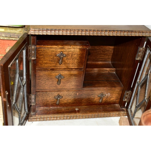 781 - AN OAK SMOKERS CABINET, lacks tobacco jar and key, approximate dimensions - height 29cm, width 31cm,... 