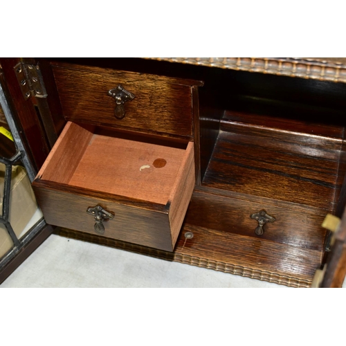 781 - AN OAK SMOKERS CABINET, lacks tobacco jar and key, approximate dimensions - height 29cm, width 31cm,... 