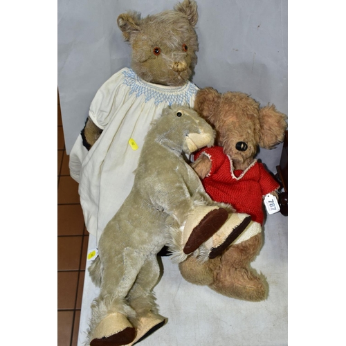 787 - THREE 20TH CENTURY SOFT TOYS , comprising a jointed bear with well-worn plush and replacement pads t... 