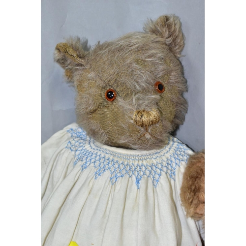 787 - THREE 20TH CENTURY SOFT TOYS , comprising a jointed bear with well-worn plush and replacement pads t... 