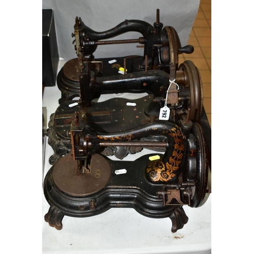 792 - THREE VICTORIAN CAST IRON SEWING MACHINES, hand cranked mechanism, with gilt or painted decoration o... 