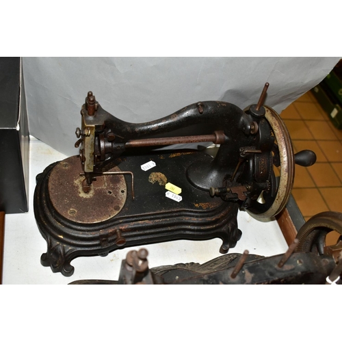 792 - THREE VICTORIAN CAST IRON SEWING MACHINES, hand cranked mechanism, with gilt or painted decoration o... 