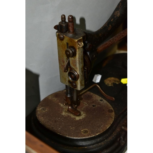 792 - THREE VICTORIAN CAST IRON SEWING MACHINES, hand cranked mechanism, with gilt or painted decoration o... 