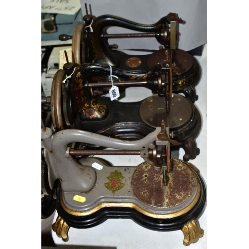 800 - THREE ANTIQUE JONES CAST IRON SEWING MACHINES, hand cranked mechanism, with gilt or painted decorati... 