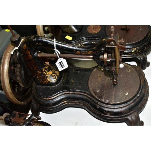 800 - THREE ANTIQUE JONES CAST IRON SEWING MACHINES, hand cranked mechanism, with gilt or painted decorati... 