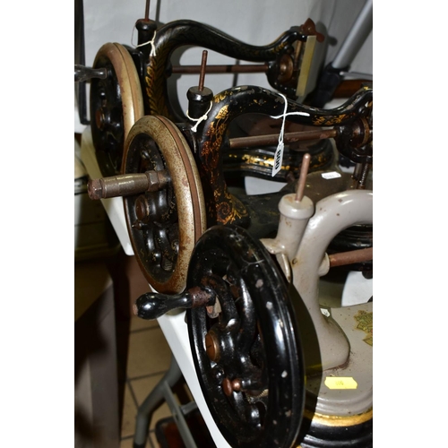 800 - THREE ANTIQUE JONES CAST IRON SEWING MACHINES, hand cranked mechanism, with gilt or painted decorati... 