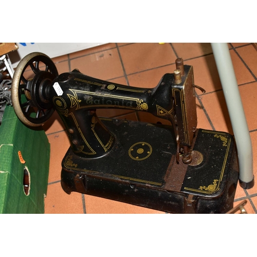 802 - THREE CAST IRON SEWING MACHINES, late nineteenth/early twentieth century, comprising an American Eat... 