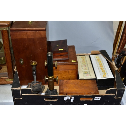 809 - A BOX OF MICROSCOPE PARTS AND SLIDES, to include an unmarked brass microscope in a wooden case (in p... 