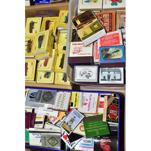 819 - TWO BOXES OF MATCH BOXES AND MATCH BOOKS, mostly empty, to include a British steam Locomotive series... 