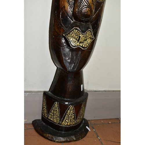 825 - A TALL WOODEN TRIBAL MASK, modern and free standing with carved, painted and applied details, height... 