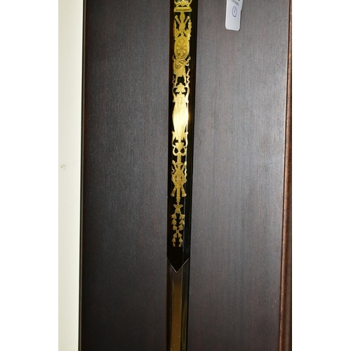 826 - A NAPOLEON I REPLICA SWORD, together with a wooden wall hanging mount bearing an engraved plaque ''E... 