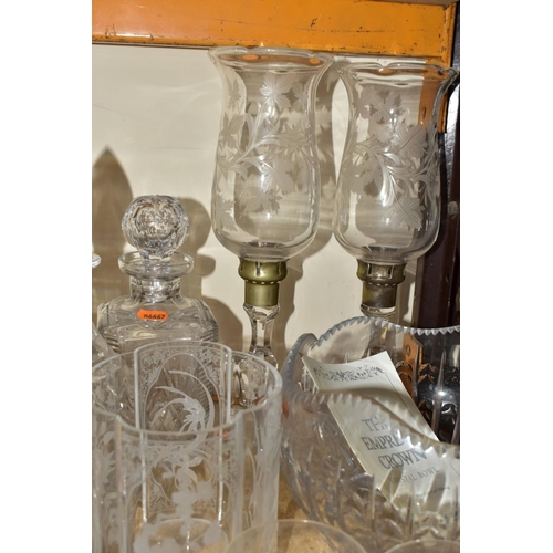 838 - A GROUP OF CUT CRYSTAL AND OTHER GLASSWARES, to include a pair of tall candle holders etched with vi... 