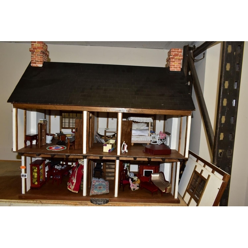 858 - A DOLLS HOUSE, exterior in Tudor style, with four rooms, hallway, stairs and landing, a two section ... 