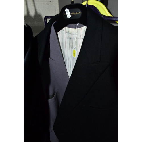 959 - THREE GENTLEMEN'S BLACK WEDDING TAIL COATS AND TWO PAIRS OF TROUSERS, the tails comprise Magee 44L, ... 