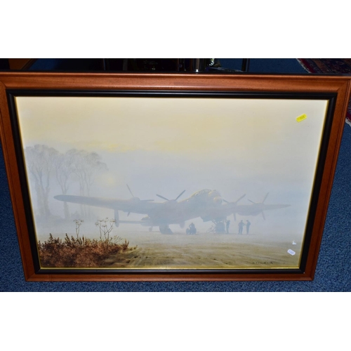 968 - THREE LARGE GLAZED FRAMED MILITARY PRINTS, to include RAF Lancaster Bomber in early morning light by... 