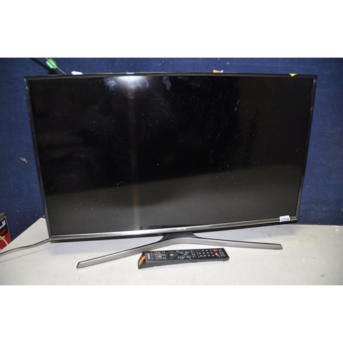 1254 - A SAMSUNG 32in SMART TV with remote model No UE32J5600AK (PAT pass and working)