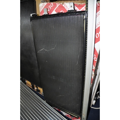 1299 - FOUR NEW BUT SLIGHTLY DAMAGED CAR RADIATORS in boxes no indication of makes or models of vehicles th... 