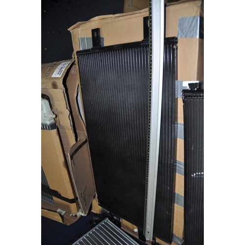 1299 - FOUR NEW BUT SLIGHTLY DAMAGED CAR RADIATORS in boxes no indication of makes or models of vehicles th... 