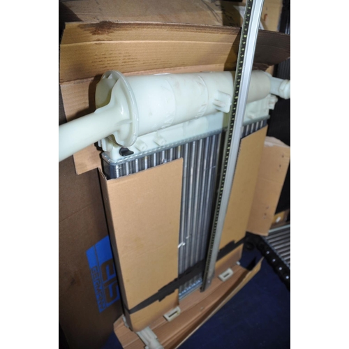 1299 - FOUR NEW BUT SLIGHTLY DAMAGED CAR RADIATORS in boxes no indication of makes or models of vehicles th... 